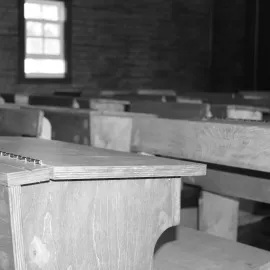 Close up on old style school desks